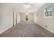 Spacious bedroom with carpet flooring, bright lighting, and access to the backyard at 3743 Tree Bark Trl, Decatur, GA 30034