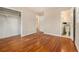 Neutral bedroom featuring hardwood floors, closet and access to the bathroom at 3743 Tree Bark Trl, Decatur, GA 30034