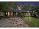 Charming brick home with a well-maintained front yard and classic black shutters at twilight at 3743 Tree Bark Trl, Decatur, GA 30034