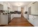 Bright kitchen featuring white cabinets, stainless steel appliances, and granite countertops at 3743 Tree Bark Trl, Decatur, GA 30034