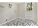 Laundry room featuring tiled floors, neutral walls, an exterior door and air conditioning unit at 3743 Tree Bark Trl, Decatur, GA 30034