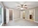 Bedroom with neutral walls and carpet showing closet and bathroom doorways at 7104 Santa Fe Pkwy, Atlanta, GA 30350