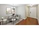 This dining room includes hardwood flooring and a designer chandelier at 7104 Santa Fe Pkwy, Atlanta, GA 30350