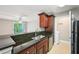 This updated kitchen includes stainless steel appliances and granite countertops at 7104 Santa Fe Pkwy, Atlanta, GA 30350