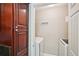 A utility area with modern washer and dryer units, plus built-in shelving and dark wood cabinetry at 7104 Santa Fe Pkwy, Atlanta, GA 30350