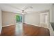 A living room offering hardwood floors and a balcony with outdoor views, creating an inviting and airy space at 7104 Santa Fe Pkwy, Atlanta, GA 30350