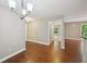 Open concept living room and dining room with hardwood floors and lots of natural light at 7104 Santa Fe Pkwy, Atlanta, GA 30350