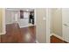 An open concept living room leads into the kitchen that has sleek, stainless steel appliances at 7104 Santa Fe Pkwy, Atlanta, GA 30350