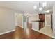 Open concept living room and kitchen with views of the balcony at 7104 Santa Fe Pkwy, Atlanta, GA 30350