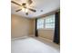 Bedroom with neutral walls, carpet, and window with curtains at 10565 Shallowford Rd, Roswell, GA 30075
