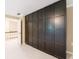 Bedroom with large dark brown closet; great for bedroom storage solutions at 10565 Shallowford Rd, Roswell, GA 30075