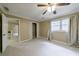 Bedroom features neutral walls, closet, and a window at 10565 Shallowford Rd, Roswell, GA 30075