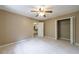 Bedroom features plush carpeting and a bi-fold closet at 10565 Shallowford Rd, Roswell, GA 30075