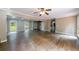 Expansive living area boasting hardwood floors, natural light, and seamless flow for comfortable living at 10565 Shallowford Rd, Roswell, GA 30075