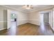 Spacious open-concept living area with hardwood floors and access to the kitchen, perfect for entertaining at 10565 Shallowford Rd, Roswell, GA 30075