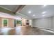 Spacious living room with fireplace, built-in shelving and hardwood floors at 10565 Shallowford Rd, Roswell, GA 30075