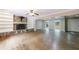 Open living area with hardwood floors, stone fireplace, built-in shelves, and plenty of natural light at 10565 Shallowford Rd, Roswell, GA 30075