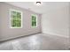 Bedroom with dual windows providing ample natural light and neutral colored walls at 150 Doris Path, Dallas, GA 30157