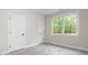 Bedroom featuring natural light from large window and modern white doors at 150 Doris Path, Dallas, GA 30157
