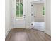 Bright foyer featuring hardwood floors and an open doorway at 150 Doris Path, Dallas, GA 30157