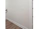 Hallway with neutral colored walls and baseboards; flooring partially visible at 150 Doris Path, Dallas, GA 30157
