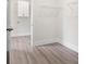 Spacious laundry room featuring vinyl floors and ample shelving space for storage at 150 Doris Path, Dallas, GA 30157