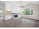 Bright living room with a stone fireplace and built-in shelving at 150 Doris Path, Dallas, GA 30157