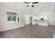 Spacious living room connected to a modern kitchen and large windows at 150 Doris Path, Dallas, GA 30157