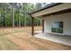 Covered patio showcasing stained wood ceiling, dark posts and a spacious lawn at 150 Doris Path, Dallas, GA 30157
