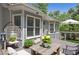 Inviting back deck with comfortable hanging chair, outdoor table, and plenty of space for relaxation and entertaining at 4825 Brighton Lake Dr, Cumming, GA 30040