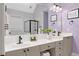 Modern bathroom featuring dual sinks, sleek countertops, and a glass-enclosed shower for a spa-like experience at 4825 Brighton Lake Dr, Cumming, GA 30040