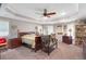 Relaxing bedroom features a wooden bed frame, ceiling fan, and ample natural light for a comfortable retreat at 4825 Brighton Lake Dr, Cumming, GA 30040