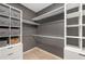 Organized walk-in closet features custom shelving, drawers, and ample storage space for clothing and accessories at 4825 Brighton Lake Dr, Cumming, GA 30040