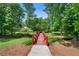 Quaint community bridge surrounded by lush greenery, enhancing the natural beauty of the neighborhood at 4825 Brighton Lake Dr, Cumming, GA 30040