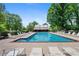 Community pool with lounge chairs and pool house, offering a refreshing oasis for residents on sunny days at 4825 Brighton Lake Dr, Cumming, GA 30040