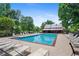 Community pool offers a refreshing escape with ample seating and a charming pavilion for relaxation at 4825 Brighton Lake Dr, Cumming, GA 30040