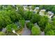 Overhead view of a residence surrounded by mature trees and green landscaping at 3157 Sawyer Ne Ct, Marietta, GA 30066
