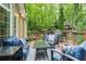 Relaxing back deck with comfortable seating and scenic wooded views at 3157 Sawyer Ne Ct, Marietta, GA 30066