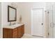 Neutral bathroom with dark wood vanity, white countertop, sink, mirror and shower stall at 3157 Sawyer Ne Ct, Marietta, GA 30066