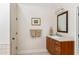 Neutral bathroom with dark wood vanity, white countertop, sink and mirror at 3157 Sawyer Ne Ct, Marietta, GA 30066