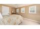 Cozy bedroom with neutral color scheme, carpeted floors, and three windows at 3157 Sawyer Ne Ct, Marietta, GA 30066