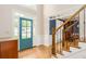Inviting foyer with hardwood floors, staircase, and a view into the formal dining room at 3157 Sawyer Ne Ct, Marietta, GA 30066