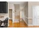 Hallway with wood flooring, stairs, and neutral paint tones at 3157 Sawyer Ne Ct, Marietta, GA 30066
