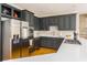 Modern kitchen featuring sleek gray cabinetry, stainless steel appliances, and a bright quartz countertop at 3157 Sawyer Ne Ct, Marietta, GA 30066
