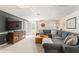 Spacious living room with large sectional sofa and a big screen TV at 3157 Sawyer Ne Ct, Marietta, GA 30066