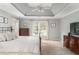 Bedroom featuring tray ceiling, neutral walls and carpet and large windows at 3157 Sawyer Ne Ct, Marietta, GA 30066