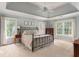 Spacious main bedroom with tray ceiling, large windows, and neutral decor at 3157 Sawyer Ne Ct, Marietta, GA 30066