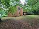 Spacious backyard featuring a brick home with a wooden deck, perfect for outdoor enjoyment at 3723 Raiders Ridge Dr, Lithonia, GA 30038