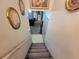 View down the stairs into the finished basement with decorative decor and bonus storage at 3723 Raiders Ridge Dr, Lithonia, GA 30038