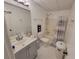 Bright bathroom featuring a shower and tub combo at 3723 Raiders Ridge Dr, Lithonia, GA 30038